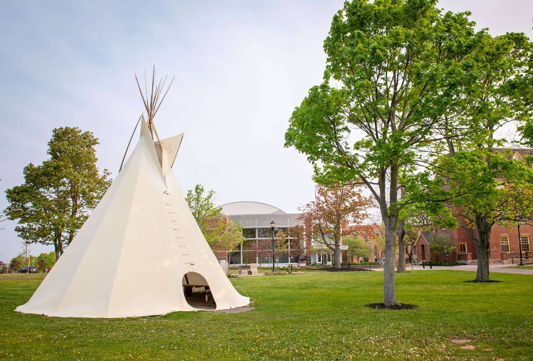 A tipi at UPEI, erected between the Kelley Memorial Building and the W.A. Murphy Student Centre in the Spring of 2022